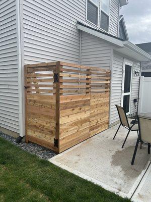 Fence to hide my AC unit and hopefully minimize noise when we are eating outside in the summer.