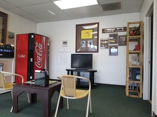 Waiting area with TV and refreshments