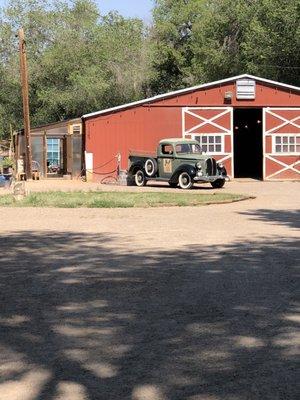 Barn that is next to outdoor seating area