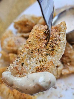 A fork with the fried pork rinds.