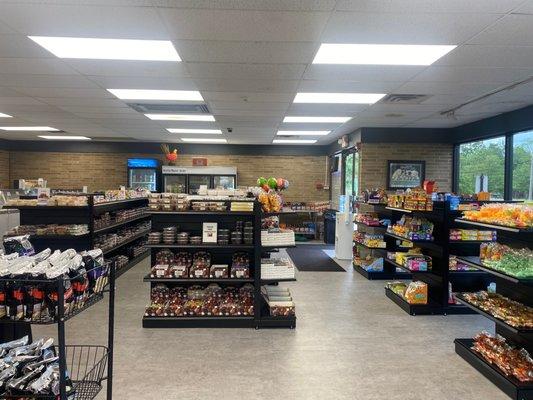 Newly remodeled store with a variety of chocolates, popcorn and ice cream.