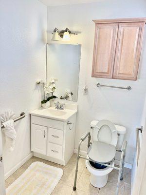 A bathroom equipped for seniors with installed safety features.