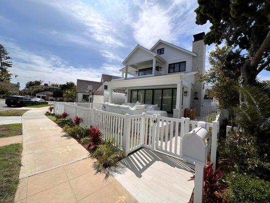 Flat front closed picket fence.