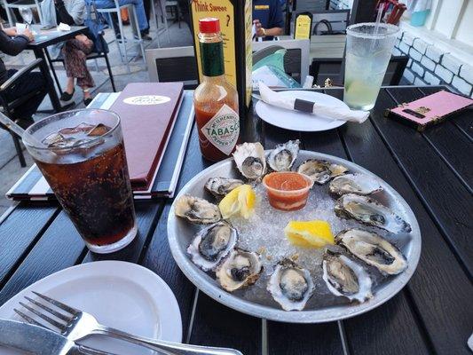 Oysters n the aftermath with nachos, burger, bread, cucumber salad n poster bar