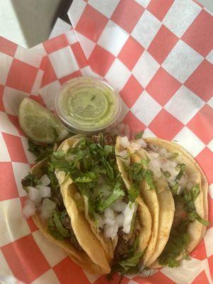 Brisket and Carne Asada Tacos with onion and Cilantro.