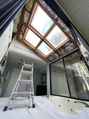 "Drywall finishing around a new skylight installation to create a clean and modern look."