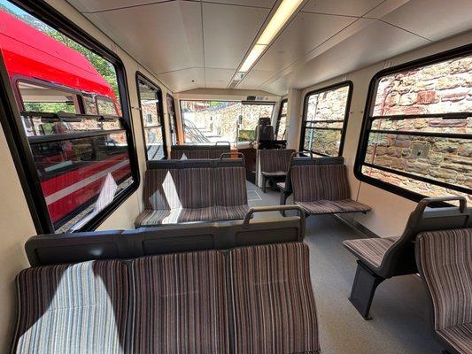 Inside the first train car where the driver drives the train going up the mountain