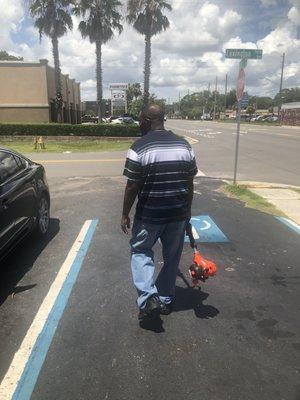 My husband leaving the store ready to get to work.