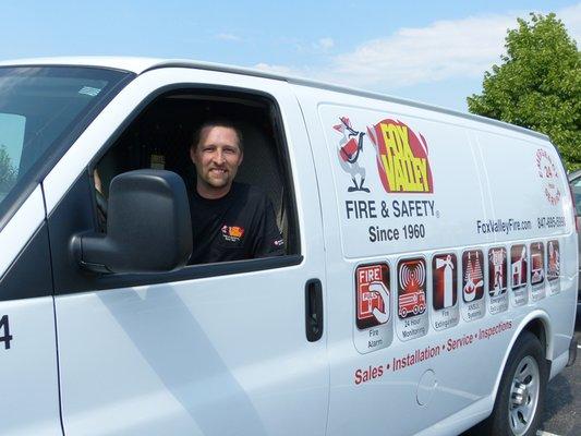 Fox Valley Fire & Safety  service vehicle leaves for a fire alarm service call in Hinsdale, IL