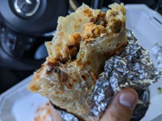 Carnitas regular burrito super schmack wrapped with their freshly house made tortilla