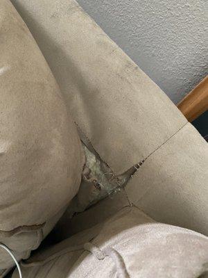 Ripped sofa purchased for me by my mother before she passed of cancer!