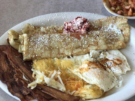 This is a #2 bacon two eggs and swedish pancakes I got a side of hash browns to soak up the fresh eggs