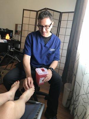 Dr. Craig taking out the needles,   which is painless, after a relaxing acupuncture treatment.  Thank you Dr. Craig!