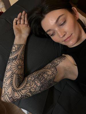 Ornamental sleeve tattoo by Kandace layne