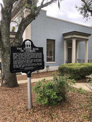 The entrance is on the side of the building.