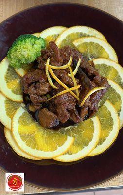 Orange Beef - Strips of seasoned tenderloin sautéed in an aromatic sauce of dried peppercorns & orange peels.