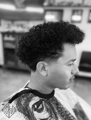 Mid Skin Taper w/ wavy curls on top!  #haircut #barbershop #Fade