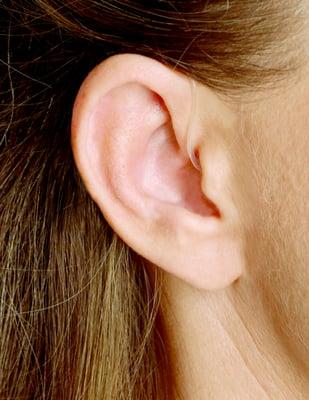 Receiver-in-Canal hearing aids sit behind your ear with a thin tube that delivers sound to your eardrum.