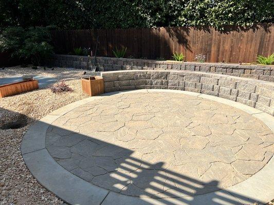 Seating area for chairs and a gas fire pit.