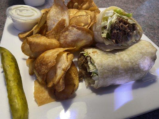 Steak and cheese wrap and hot chips