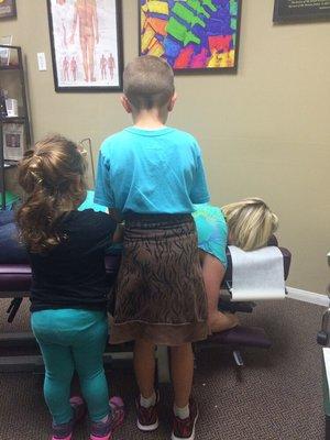 Letting my little patients work on me.  It's fun and helps build trust!