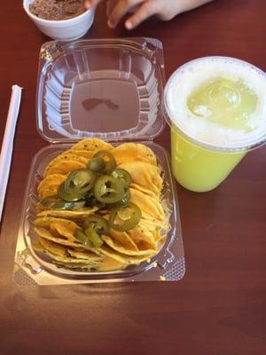 Nachos and pineapple and cucumber water