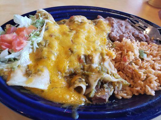 Carnitas enchilada with rice and beans