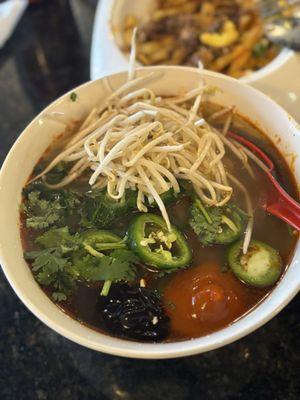 Rare eyeround steak pho with Bun Bo Hue broth