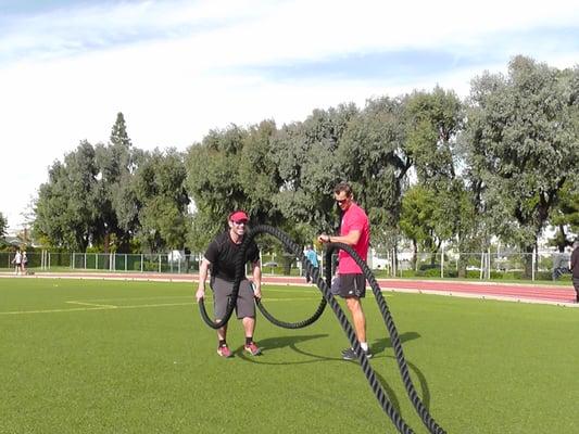 Training is not just in the gym! Here I'm preparing my client for a Spartan Obstacle Race with a track workout with battle rope intervals