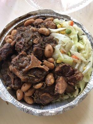 Oxtail with cabbage, rice, and beans.