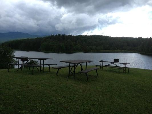 BBQ grills and picnic benches on top of the hill