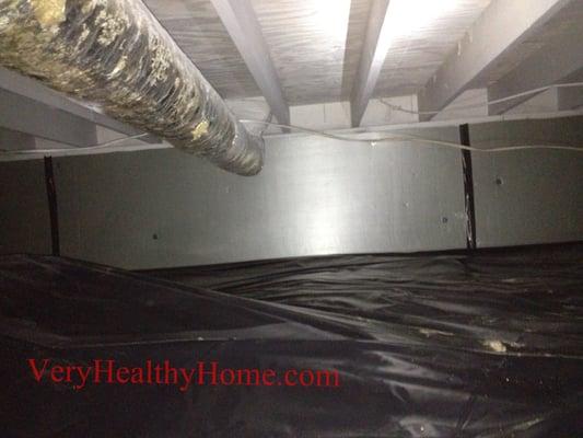 Black 6-mil vapor barrier installed with foam board insulation. Pulled fiberglass & treated for mold to pass inspection.