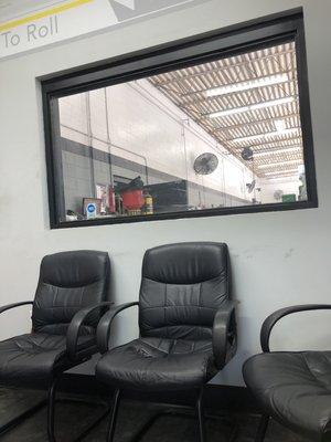 Waiting area. Tv, books and magazines, soda machine and coffee. Window to watch if need be.