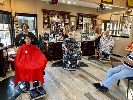 Four generations getting haircuts.