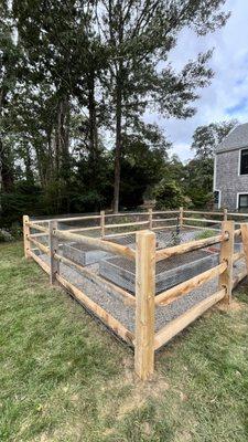 3 rail split rail with welded wire mesh garden fence.