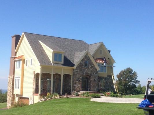 Certainteed 50 Year Architectural Shingles along with copper bay windows.