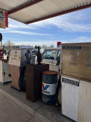 Old gas pumps and sheriff's cruiser