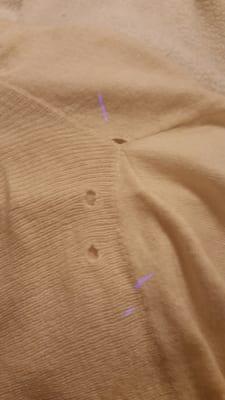 Holes in clothes destroyed by dry cleaning