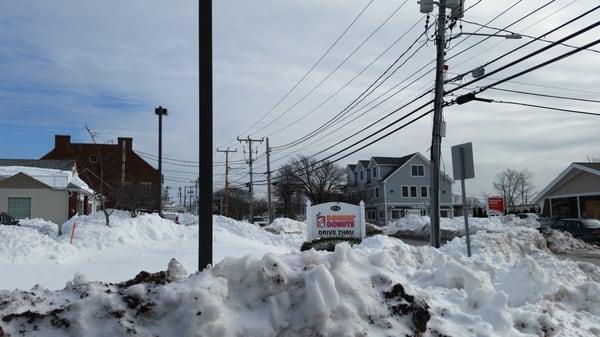 Street sign behind the snow