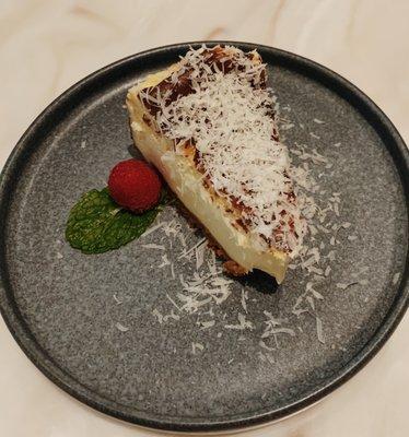 Cheesecake topped with grated Parmesan