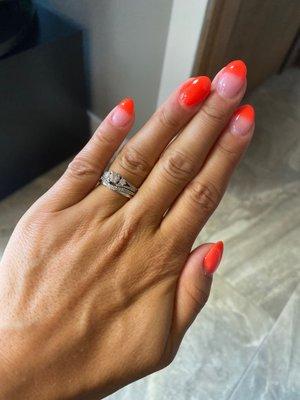 Dip polish kinda French tip style with a bright orange.