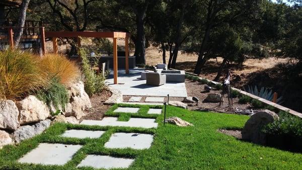 Sculpting the backyard into a haven, we transformed a steep hillside into a luxurious entertaining space...