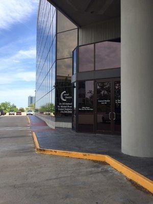 Front entrance to the office, adjacent to the main entrance of the office building.