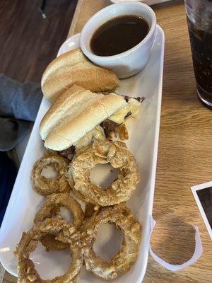 Prime rib sandwich with onion rings