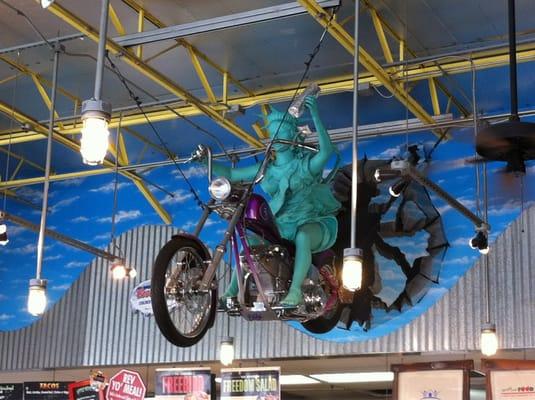 The Statue of Liberty riding a motorcycle. Just when you think you've seen everything...