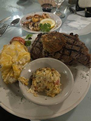 Ribeye with crab cake, shrimp, and twice baked potato.