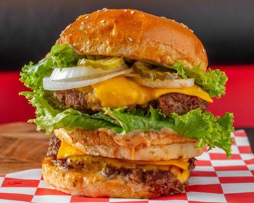 The Apollo burger comes with two Angus beef patties, American cheese, lettuce, onions, pickles and Burgers@ sauce on a sesame seed bun.