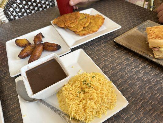 Maduros, tostones, rice and beans