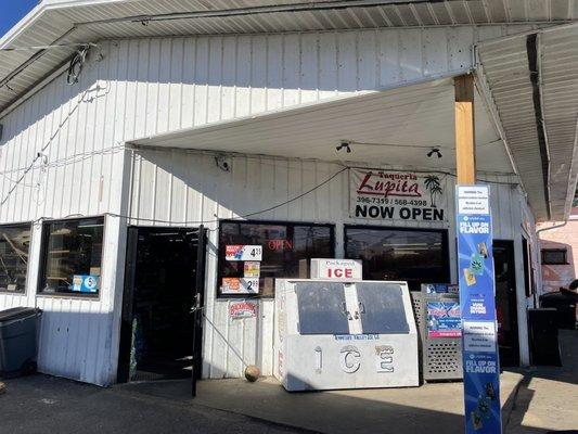 Outside entrance into gas station and taqueria