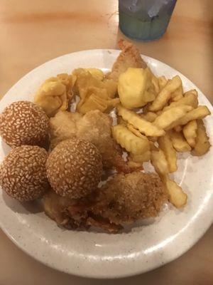 Sesame balls, fries, fried shrimp, and crab rangoon